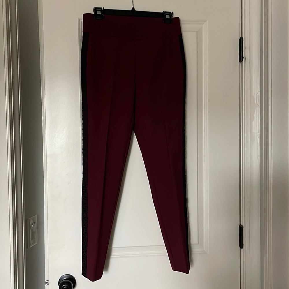 Up! burgundy pants with a side stripe.